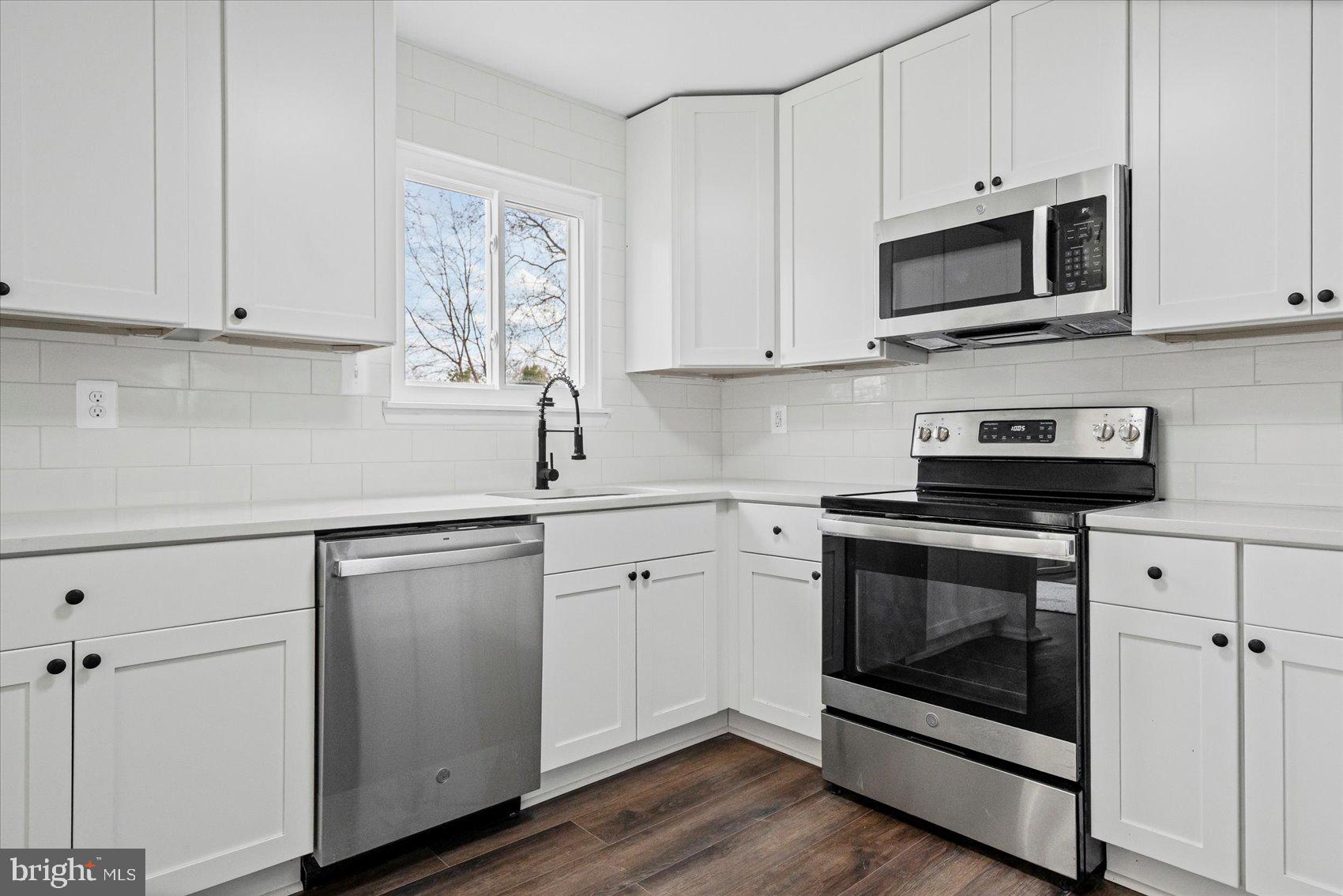 331 Laburnum Road Edgewood, MD 21040 - Photo 11 of 41 a kitchen with white cabinets stainless steel appliances and sink