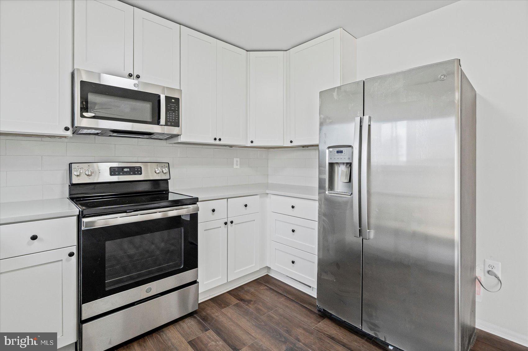331 Laburnum Road Edgewood, MD 21040 - Photo 12 of 41 a kitchen with stainless steel appliances a stove a microwave and a refrigerator
