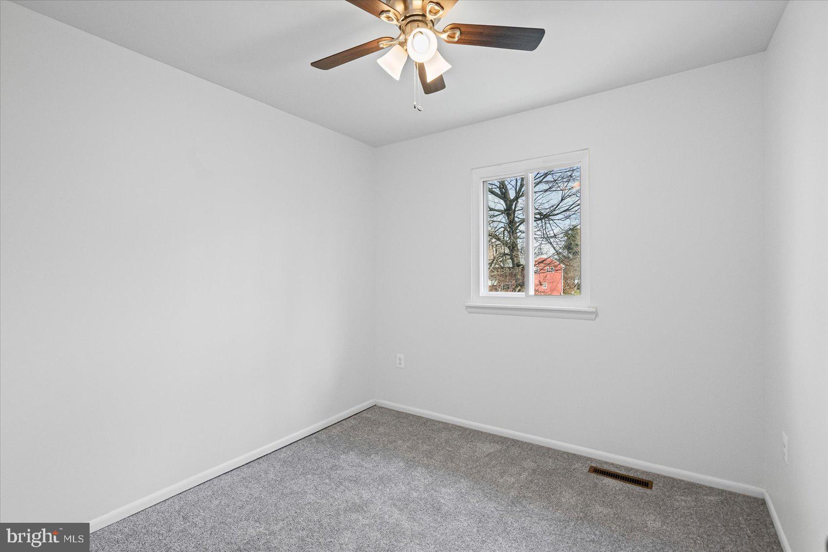 331 Laburnum Road Edgewood, MD 21040 - Photo 18 of 41 an empty room with a window and a fan