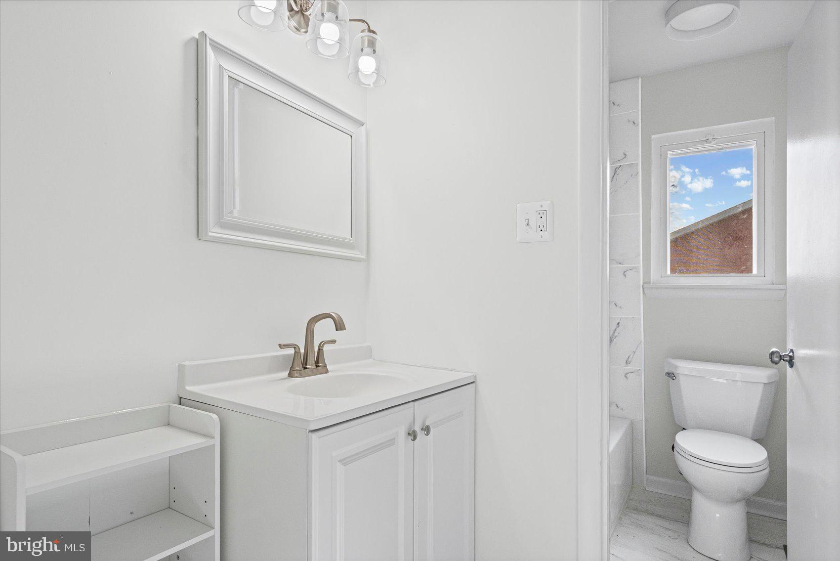 331 Laburnum Road Edgewood, MD 21040 - Photo 26 of 41 a bathroom with a toilet sink and mirror
