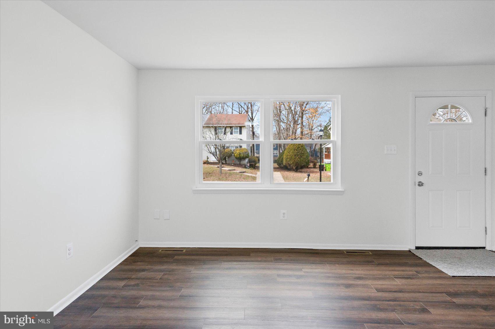 331 Laburnum Road Edgewood, MD 21040 - Photo 7 of 41 a view of an empty room with wooden floor and a window