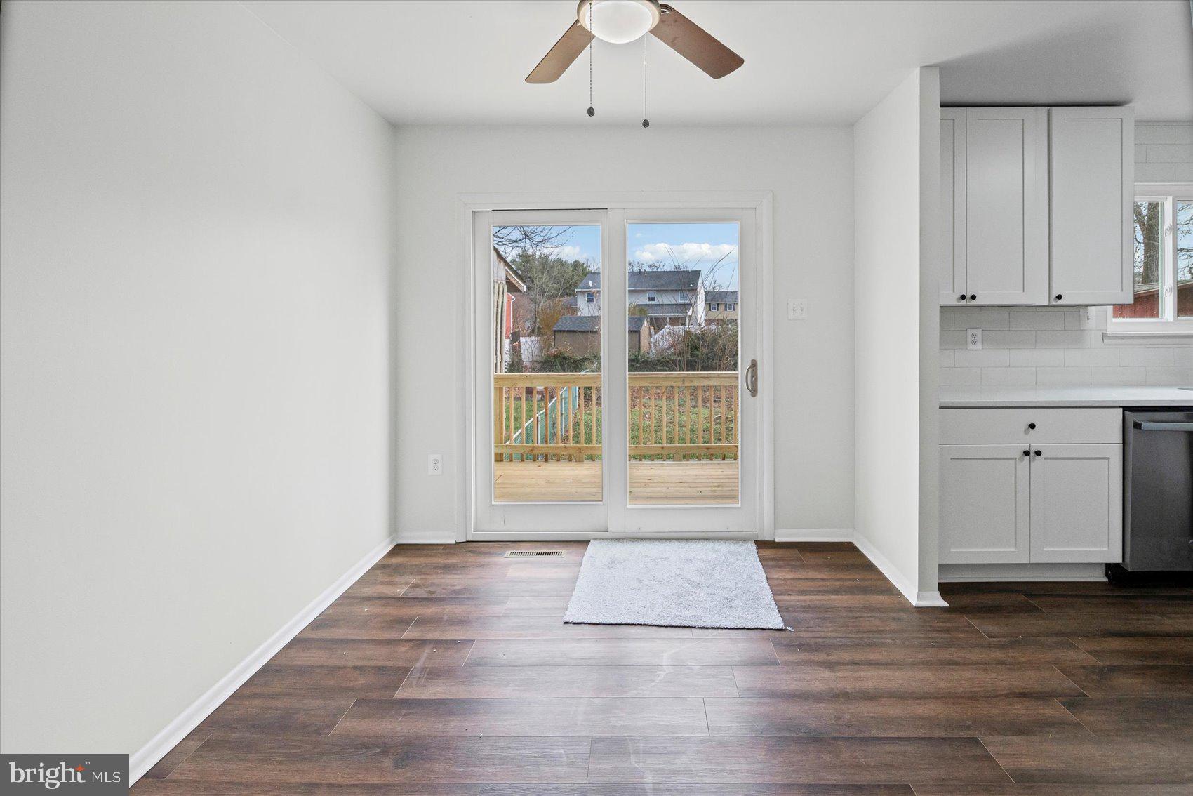 331 Laburnum Road Edgewood, MD 21040 - Photo 9 of 41 an empty room with wooden floor and windows