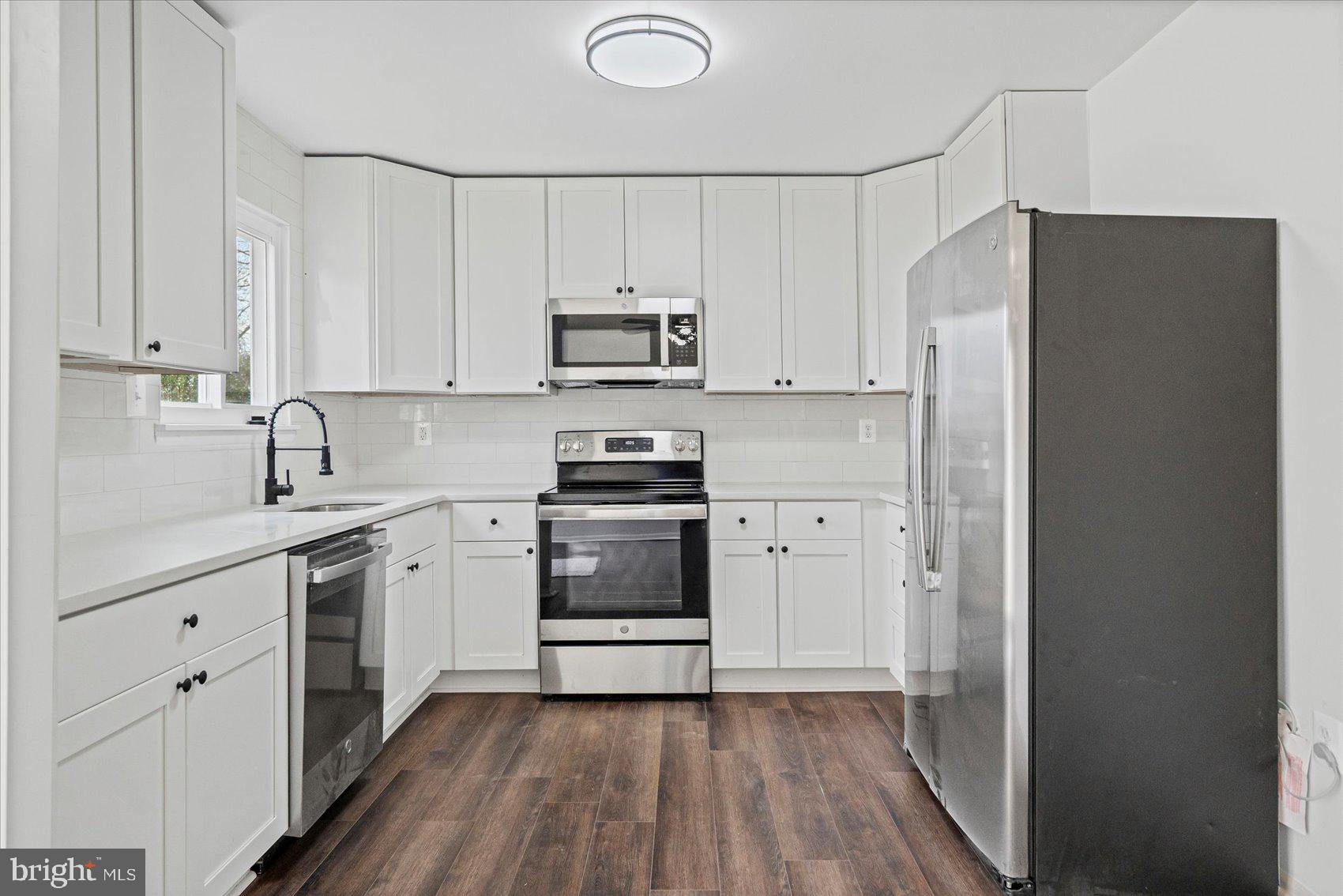 331 Laburnum Road Edgewood, MD 21040 - Photo 10 of 41 a kitchen with a white cabinets and white appliances