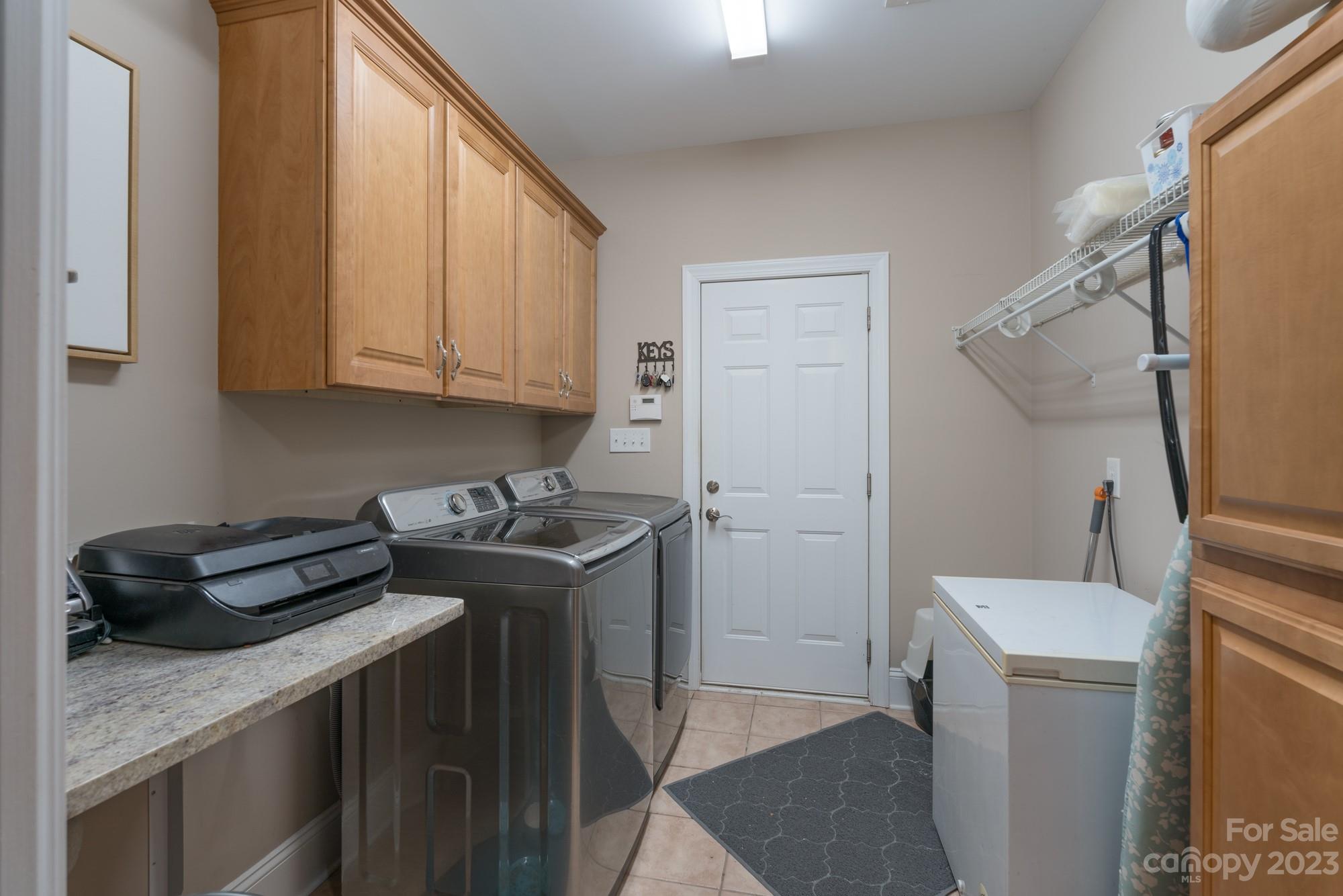 5896 Morning Star Road Lake Wylie, SC 29710 - Photo 19 of 40 a view of a storage and utility room with washer and dryer