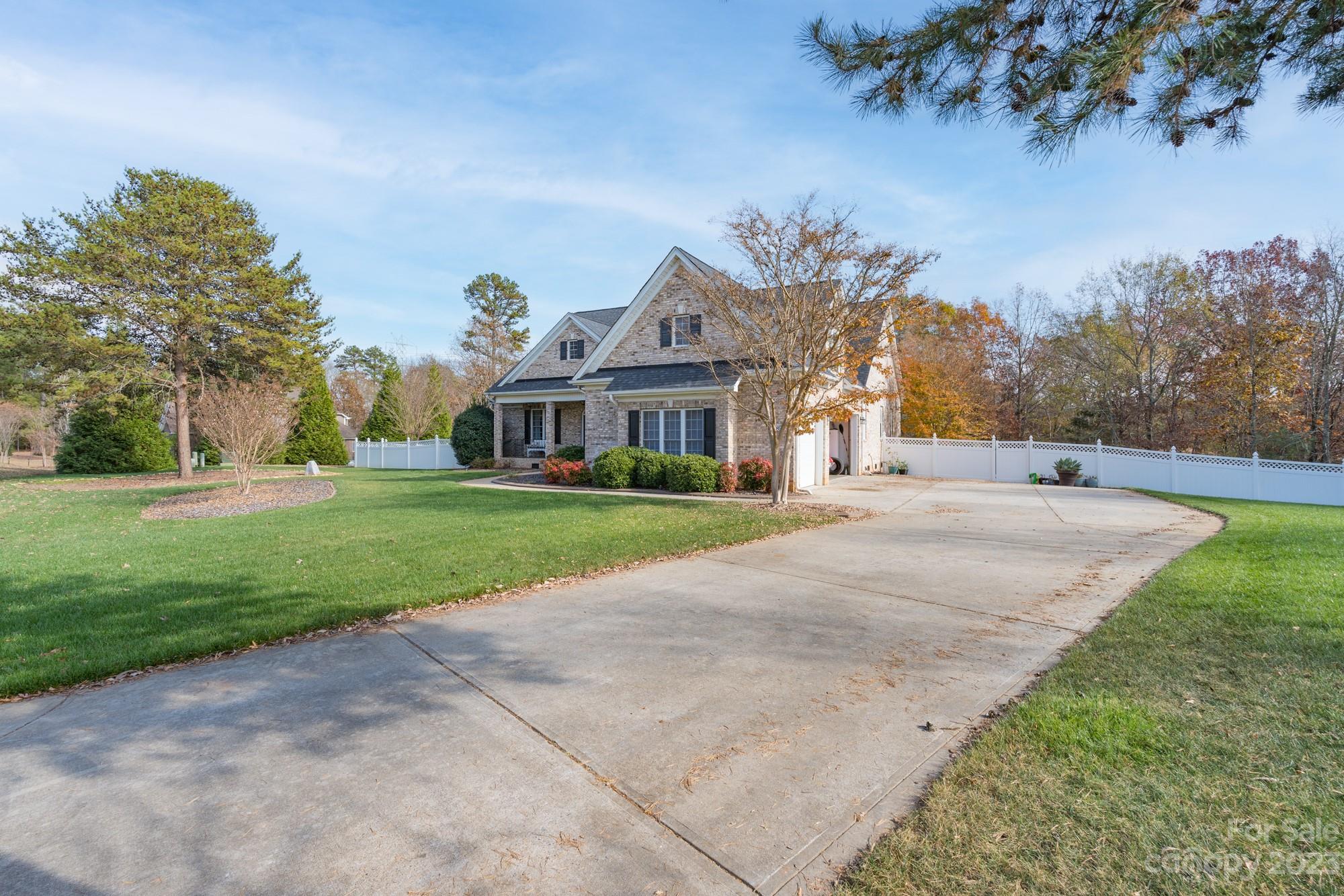 5896 Morning Star Road Lake Wylie, SC 29710 - Photo 3 of 40 a front view of house with yard and green space