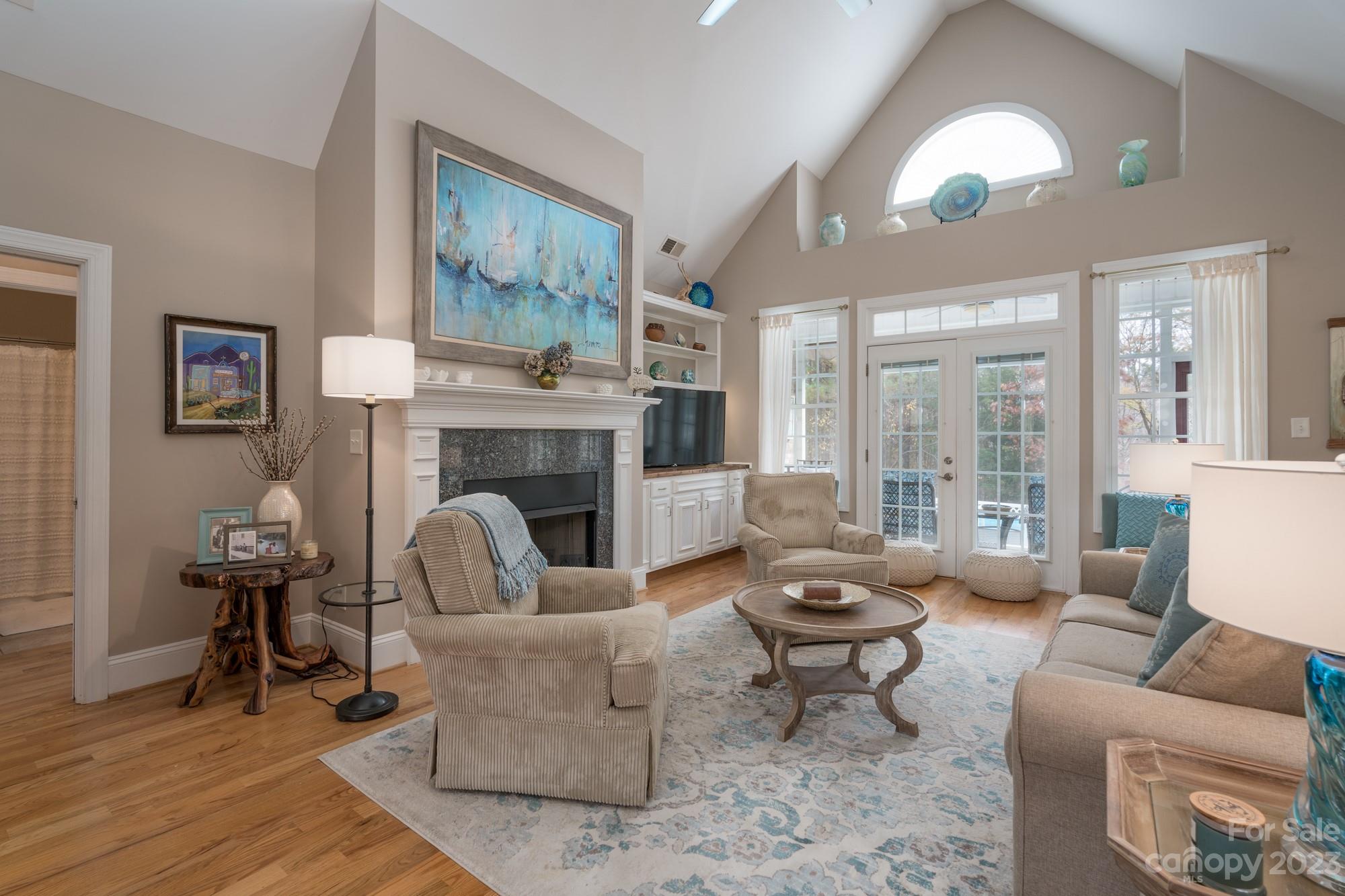 5896 Morning Star Road Lake Wylie, SC 29710 - Photo 8 of 40 a living room with furniture fireplace and large windows