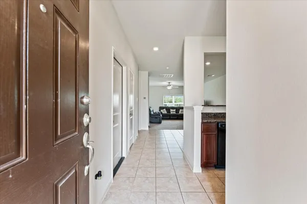 a spacious bathroom with a granite countertop sink and a mirror