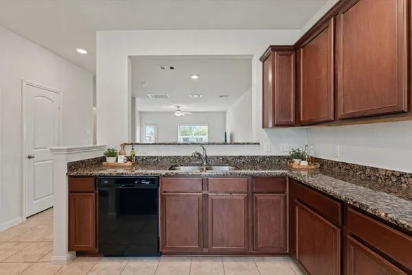 a spacious bathroom with a sink a mirror a bathtub and shower
