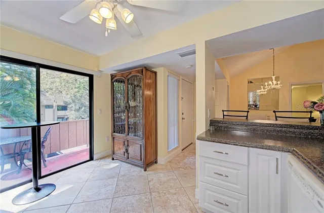 a kitchen with stainless steel appliances a stove microwave and refrigerator
