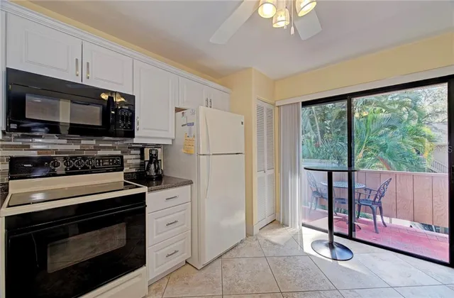 a view of balcony with wooden floor and outdoor seating