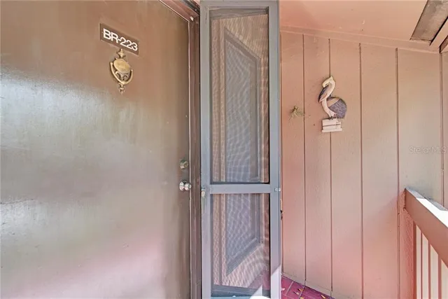 a view of a livingroom with furniture and a flat screen tv