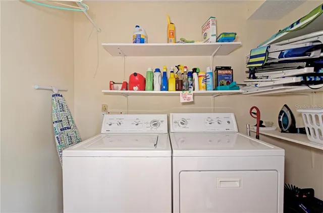 a view of a house with pool and a yard