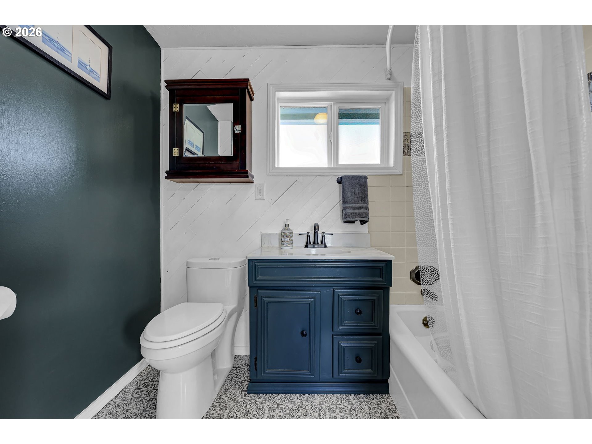 90440 Goodman Road Junction City, OR 97448 - Photo 19 of 48 a bathroom with a toilet a sink and mirror