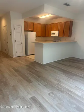 a view of a kitchen with cabinets