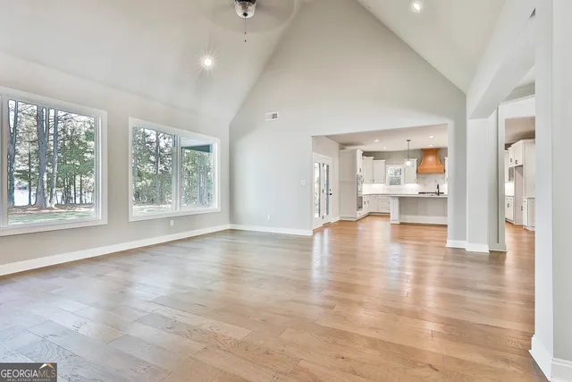 a kitchen with granite countertop a sink a window and stainless steel appliances