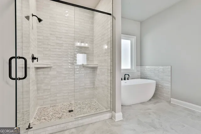 a view of a hallway with wooden floor and entryway