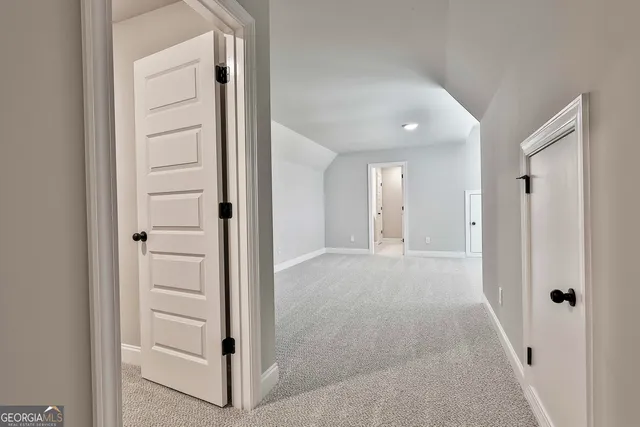 a bathroom with a sink a toilet a mirror and shower