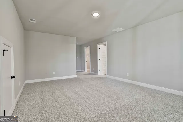 a view of a house with a large tree