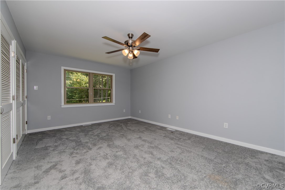 8205 Buffin Road Henrico, VA 23231 - Photo 12 of 42 an empty room with a window and a fan