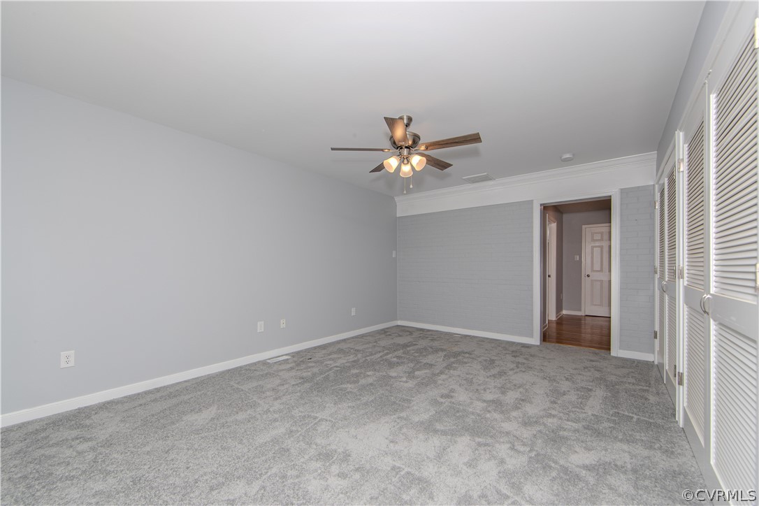 8205 Buffin Road Henrico, VA 23231 - Photo 13 of 42 a view of an empty room with chandelier fan