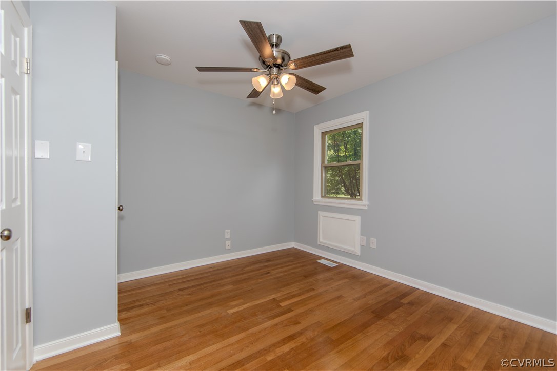 8205 Buffin Road Henrico, VA 23231 - Photo 15 of 42 a view of an empty room with wooden floor and a window