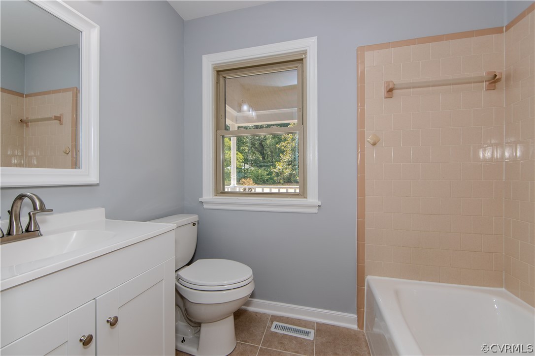 8205 Buffin Road Henrico, VA 23231 - Photo 18 of 42 a bathroom with a sink a toilet and shower