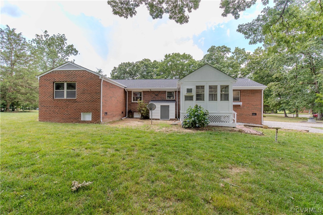 8205 Buffin Road Henrico, VA 23231 - Photo 24 of 42 a front view of a house with a garden