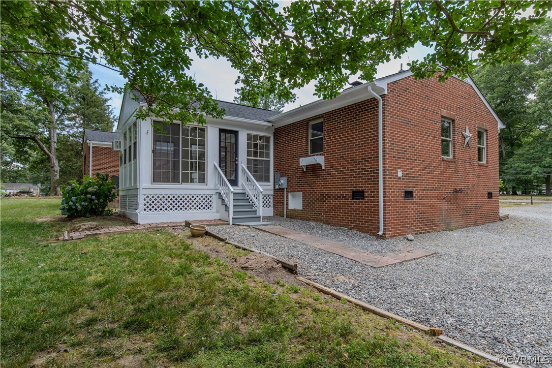 8205 Buffin Road Henrico, VA 23231 - Photo 27 of 42 a view of a house with backyard and a large tree