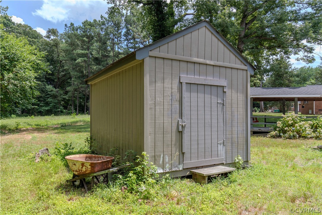 8205 Buffin Road Henrico, VA 23231 - Photo 30 of 42 a backyard of a house with yard and outdoor seating