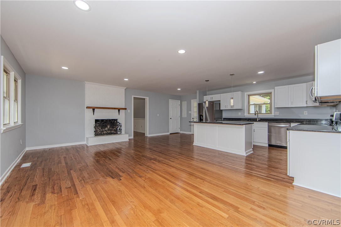 8205 Buffin Road Henrico, VA 23231 - Photo 3 of 42 a view of kitchen with granite countertop a stove top oven and a sink