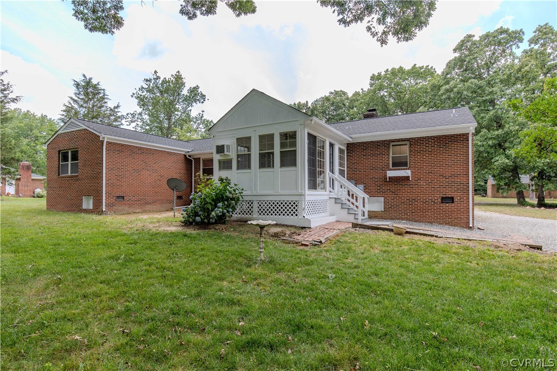 8205 Buffin Road Henrico, VA 23231 - Photo 32 of 42 a front view of house with yard and trees in the background