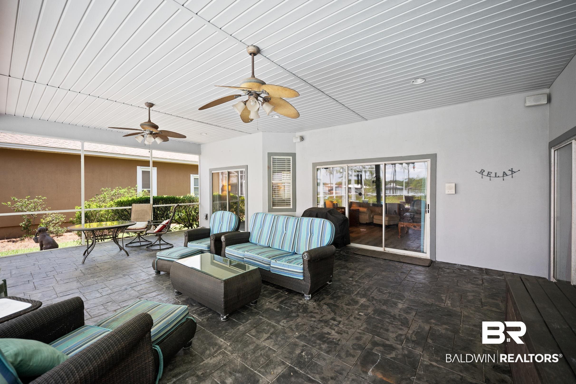 8585 Bay Harbor Road Elberta, AL 36530 - Photo 34 of 51 View of patio / terrace with an outdoor living space and ceiling fan