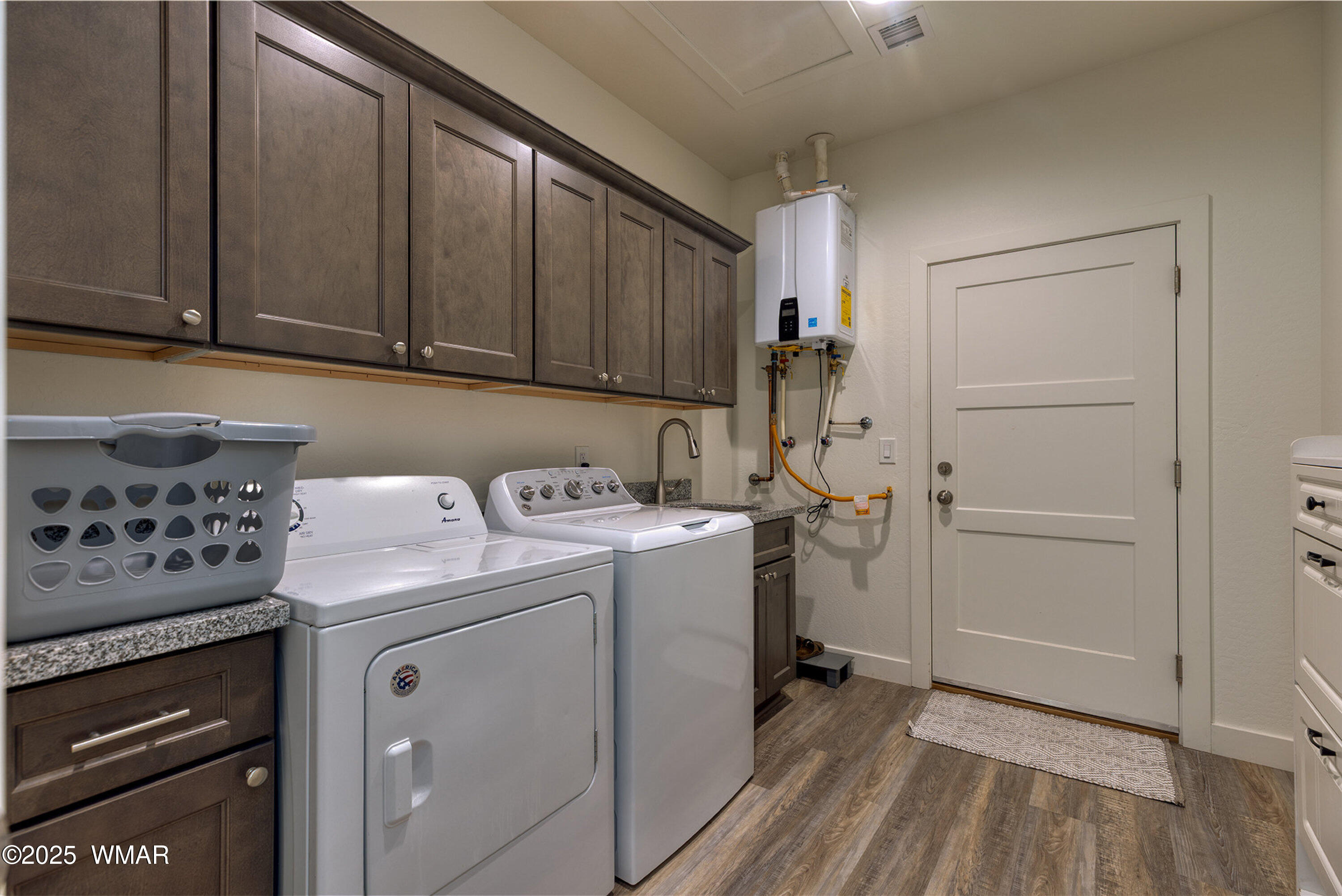 799 Cobble Lane Taylor, AZ 85939 - Photo 18 of 34 a view of storage and utility room with washer and dryer