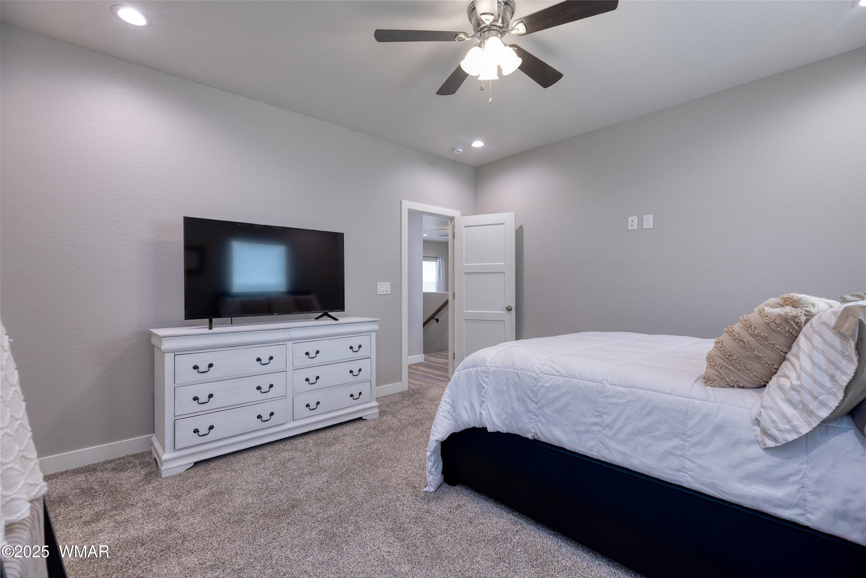 799 Cobble Lane Taylor, AZ 85939 - Photo 10 of 34 a bedroom with a bed and flat screen tv
