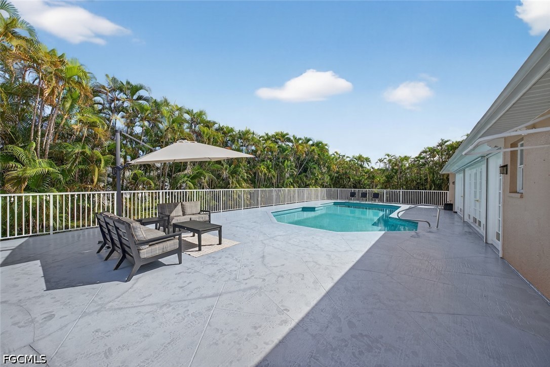 13570 Harbour Ridge Drive Fort Myers, FL 33908 - Photo 40 of 50 a view of backyard with a patio and a garden