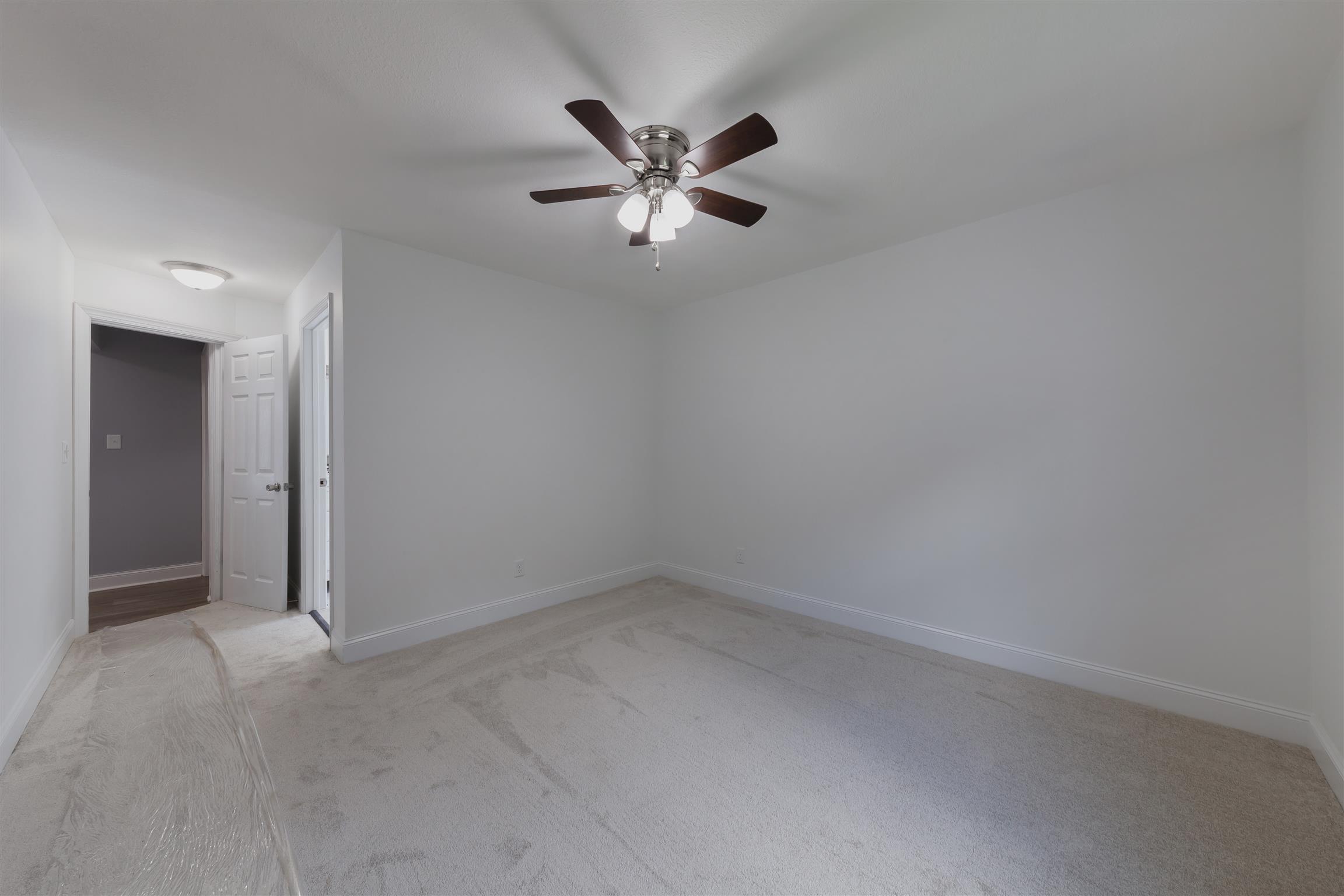 3128 Fly Road Santa Fe, TN 38482 - Photo 12 of 15 an empty room with window and ceiling fan