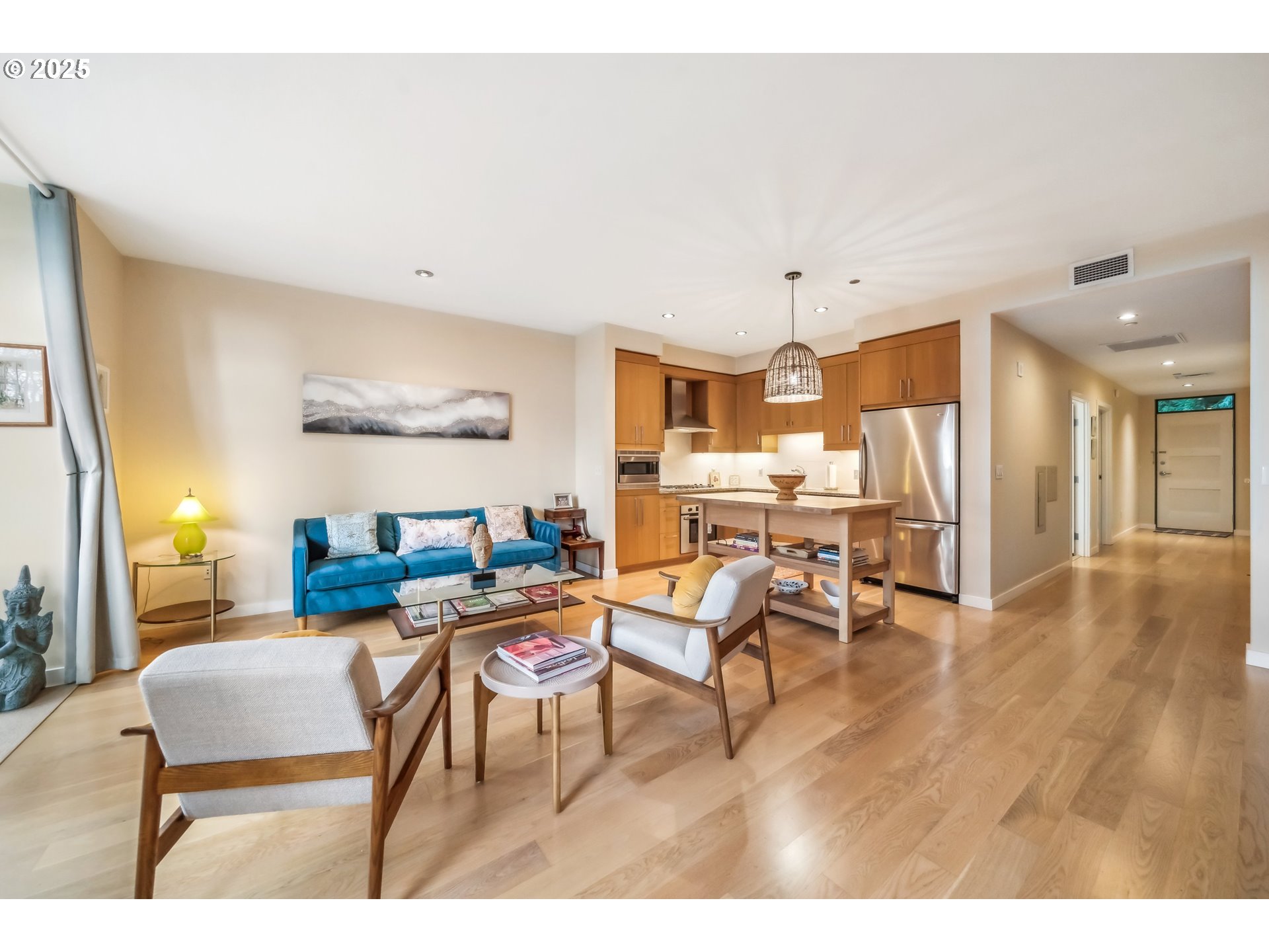2351 Northwest Westover Road, Unit 315 Portland, OR 97210 - Photo 4 of 16 a workspace with furniture and a wooden floor