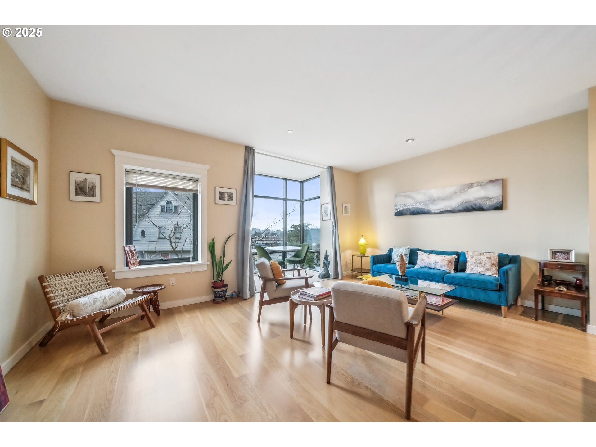 2351 Northwest Westover Road, Unit 315 Portland, OR 97210 - Photo 9 of 16 a living room with furniture and a wooden floor