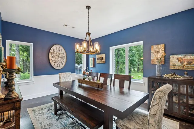 a spacious bedroom with a bed and a flat screen tv