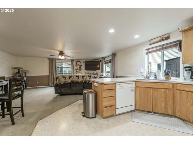 a kitchen with sink and cabinets