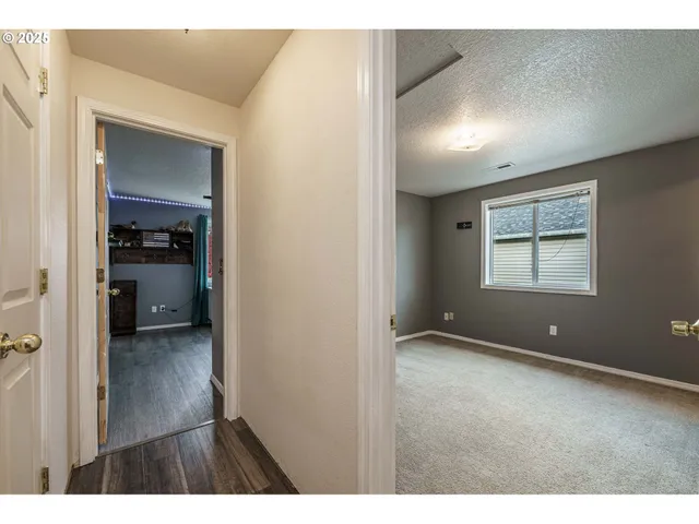 view of an empty room with a closet