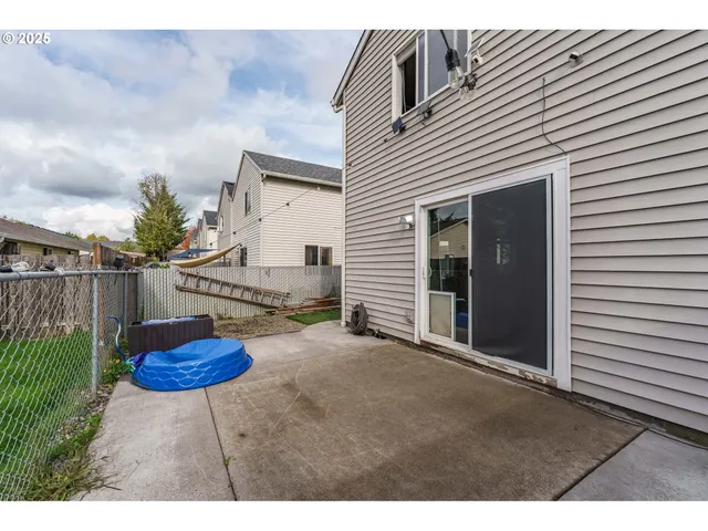 a view of a backyard with furniture and a potted plant