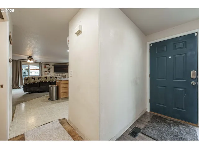 a open kitchen with a sink and dishwasher a oven with wooden floor