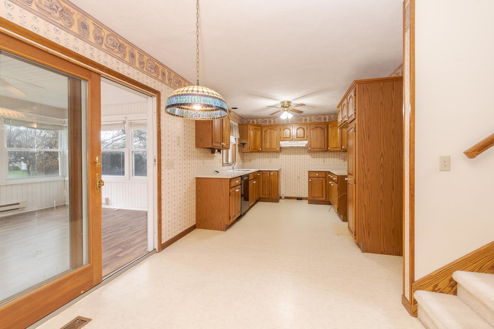 1402 East Indiana Avenue Pontiac, IL 61764 - Photo 12 of 54 a large white kitchen with a large window