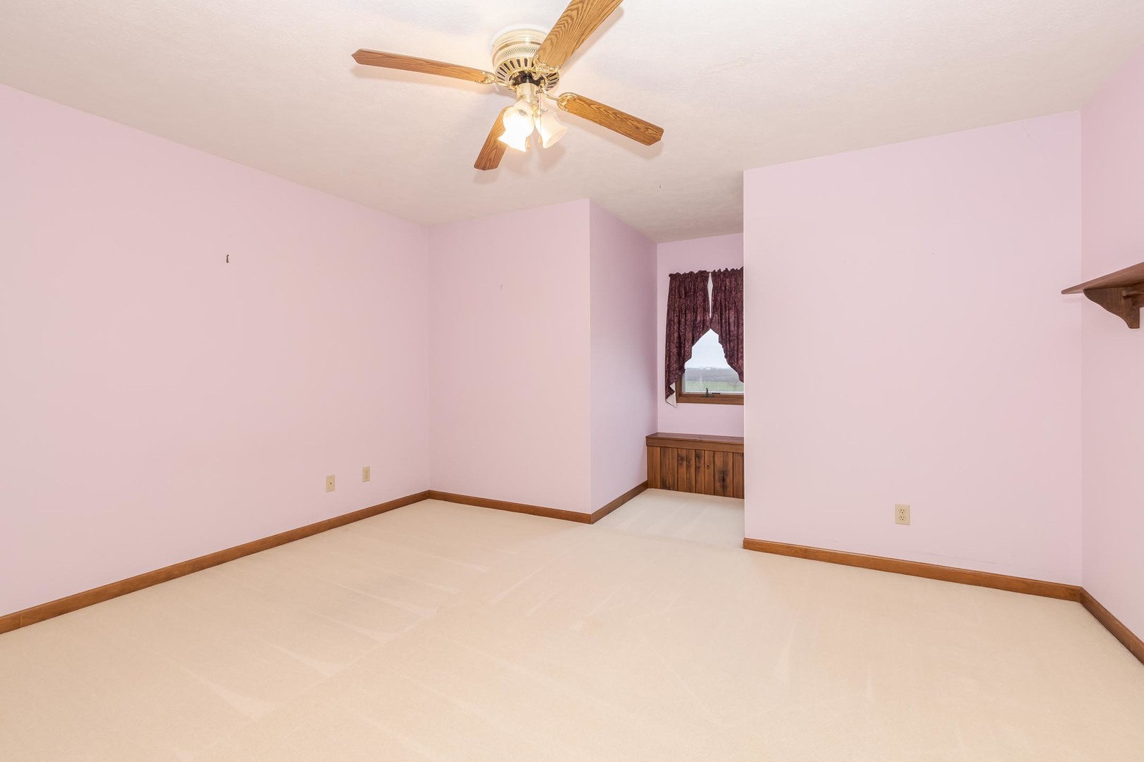 1402 East Indiana Avenue Pontiac, IL 61764 - Photo 29 of 54 an empty room with a ceiling fan and carpet