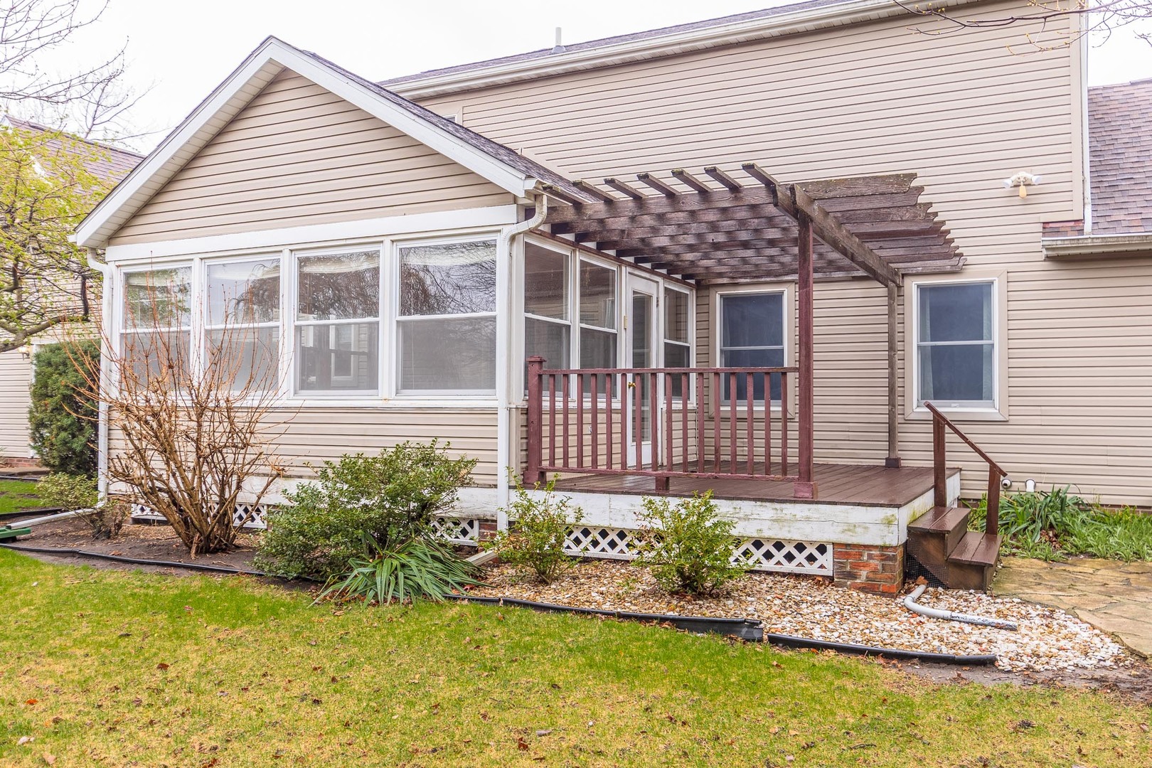 1402 East Indiana Avenue Pontiac, IL 61764 - Photo 46 of 54 a front view of a house with a yard patio and swimming pool