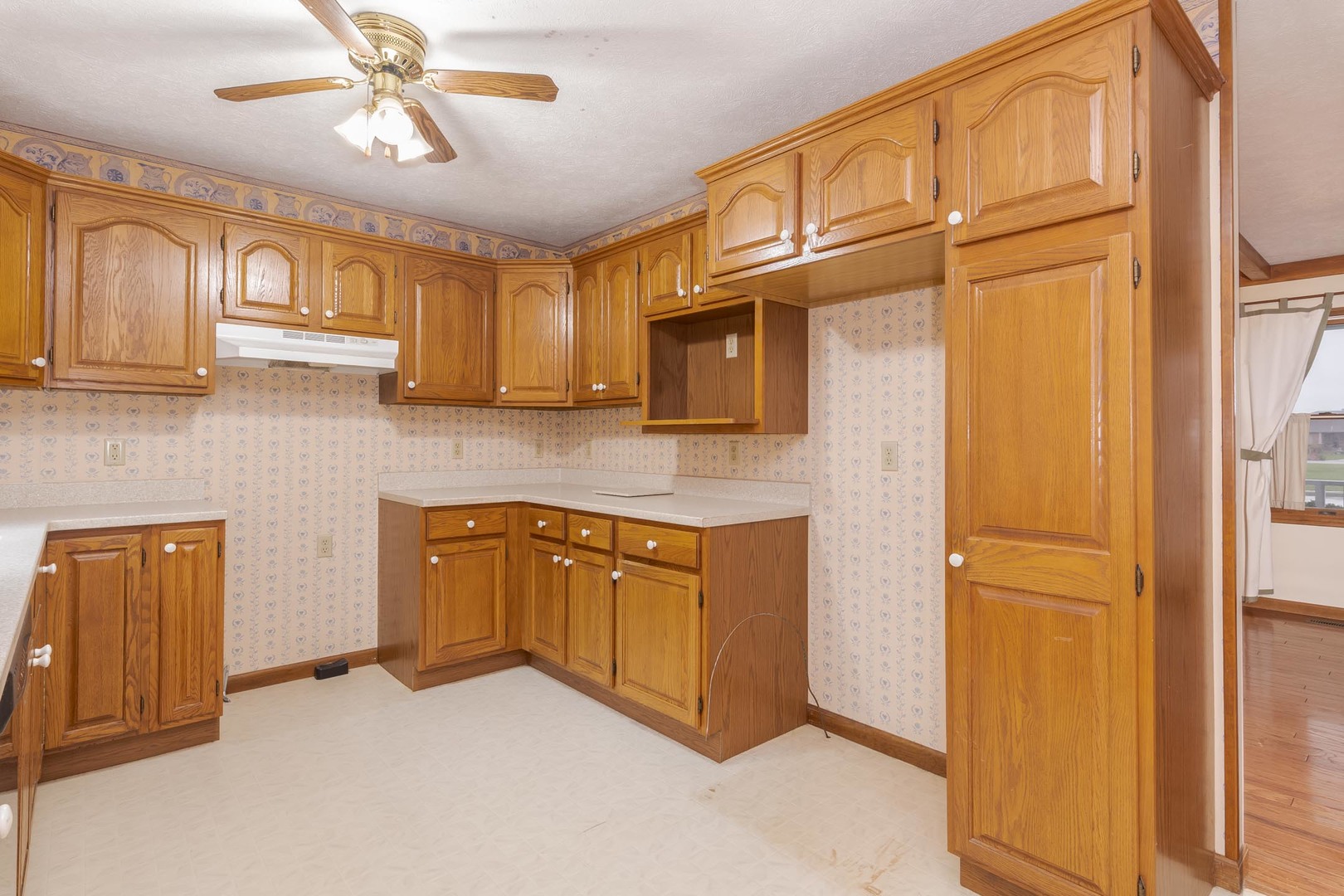1402 East Indiana Avenue Pontiac, IL 61764 - Photo 8 of 54 a kitchen with stainless steel appliances granite countertop cabinets and a refrigerator