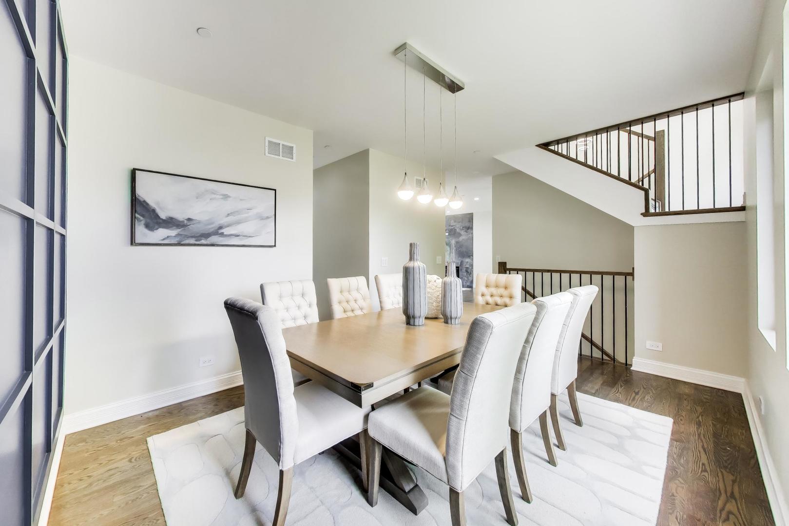 1133 Fortuna Avenue Park Ridge, IL 60068 - Photo 11 of 46 a view of a dining room with furniture and wooden floor