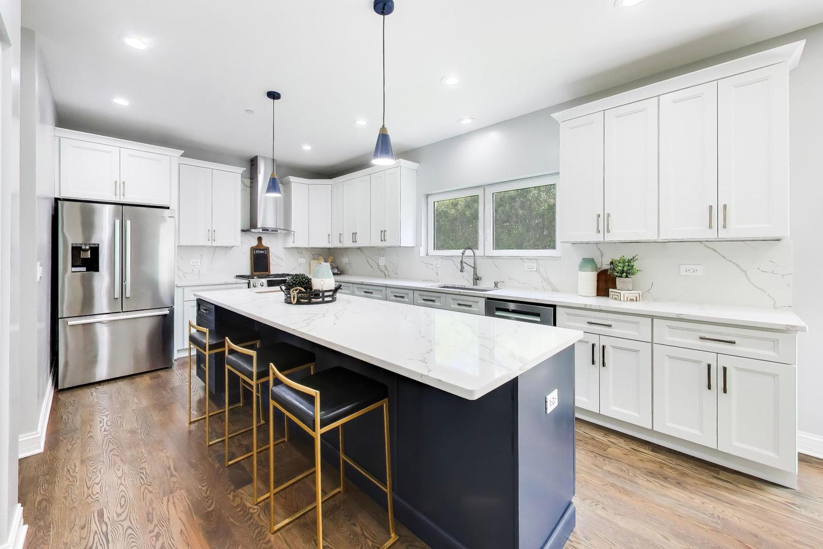 1133 Fortuna Avenue Park Ridge, IL 60068 - Photo 13 of 46 a kitchen with a center island white cabinets and stainless steel appliances