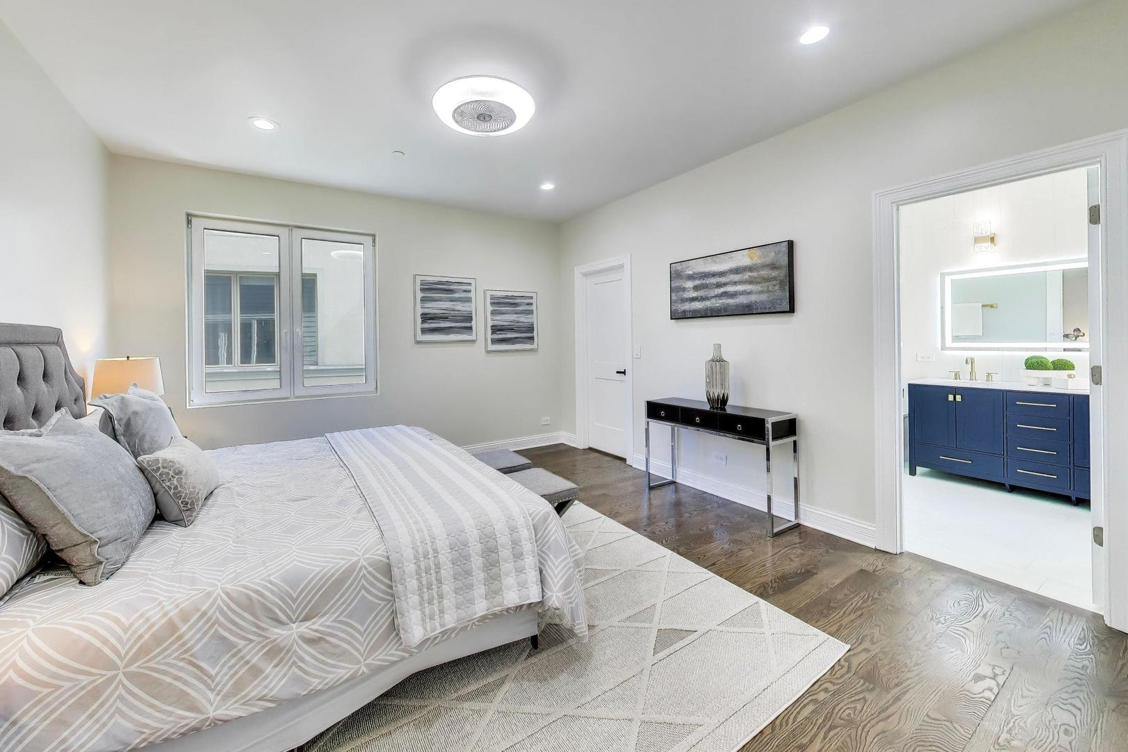 1133 Fortuna Avenue Park Ridge, IL 60068 - Photo 19 of 46 a bedroom with a large bed and a desk
